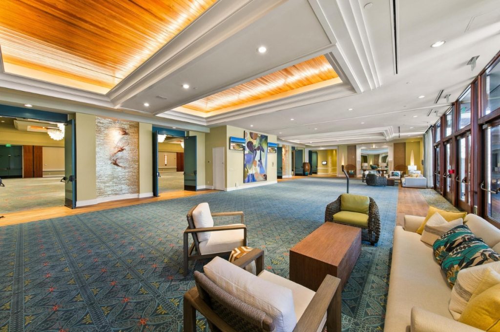 Spacious and elegant lobby area at Paradise Point Resort & Spa in San Diego with modern seating, artistic décor, and warm natural lighting.