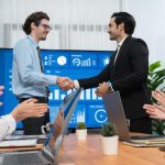 imgi_15_two-businessman-shake-hand-meeting-room-with-cheerful-colleagues-habiliment_31965-459723.jpg