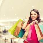depositphotos_86537308-stock-photo-smiling-young-woman-with-shopping.jpg