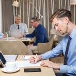 serious-young-businessman-team-working-cafe-1-1.jpg