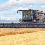 large-combine-harvester-harvesting-wheat-summer-day_155248-536.jpg