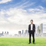 smiling-executive-with-city-distance_optimized_1000.jpg