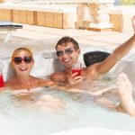 young-couple-relaxing-jacuzzi-pool-1.jpg